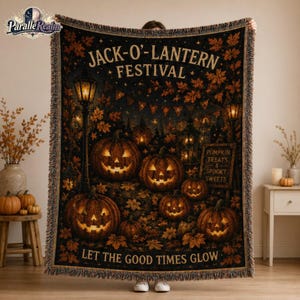 May include: A woven throw blanket featuring a dark Halloween scene with glowing jack-o'-lanterns, autumn leaves, and a vintage street lamp. The text reads JACK-O'-LANTERN FESTIVAL and LET THE GOOD TIMES GLOW, with a sign stating PUMPKIN TREATS & SPOOKY SWEETS.
