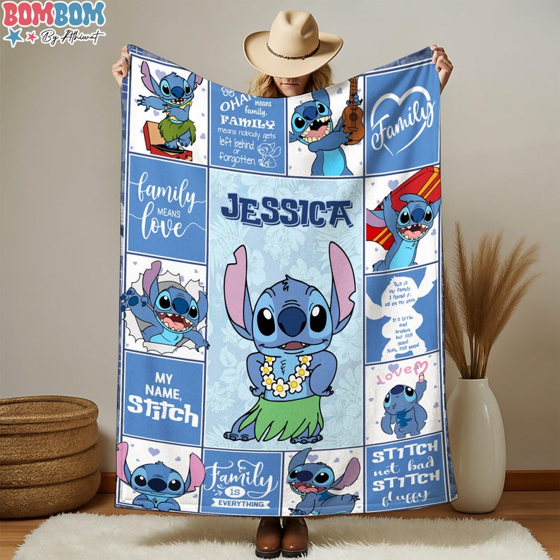 A person is holding up a quilt featuring various images of the character Stitch from the movie Lilo & Stitch.
