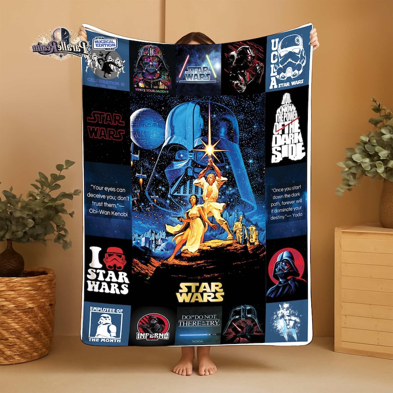 May include: A Star Wars-themed blanket featuring iconic characters and quotes. The design includes Darth Vader, Luke Skywalker, and other characters from the film series. The blanket has a blue and black color scheme with various Star Wars logos and text.