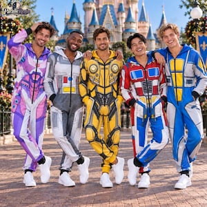 May include: Five full-body jumpsuits featuring colourful robotic character designs with front zippers. The jumpsuits are purple, grey, yellow, red, and blue, each displaying intricate mechanical patterns and paneling details across the fabric.