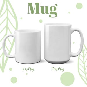 May include: Two white ceramic mugs, one 11 oz and one 15 oz, on a white background with green leaf designs.
