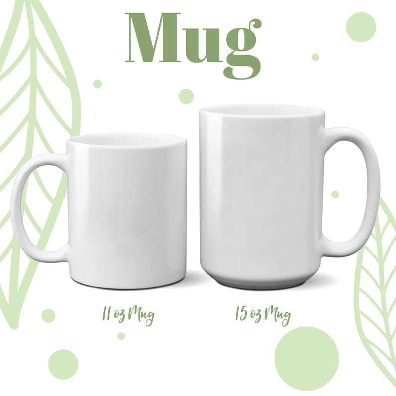 May include: Two white ceramic mugs, one 11 oz and one 15 oz, on a white background with green leaf designs.