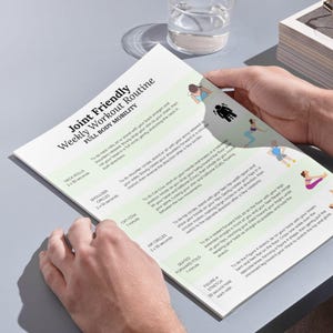 May include: A printable workout routine for full body mobility, titled "Joint Friendly Weekly Workout Routine". The routine includes exercises like neck rolls, shoulder circles, cat-cow, hip circles, seated forward fold, and figure 4 stretch.