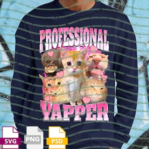 May include: Navy blue long-sleeve shirt with a graphic of several cats and the text "PROFESSIONAL YAPPER" in pink. The cats are in various poses, surrounded by pink hearts. The shirt also has SVG, PNG, and PSD file icons.