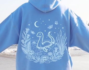Sudadera con capucha del monstruo del lago Ness, sudadera con el adorable Nessie celestial, sudadera con capucha de criatura mítica del lago, sudadera con capucha de arte críptico, sudadera con capucha tipo pulóver o cremallera