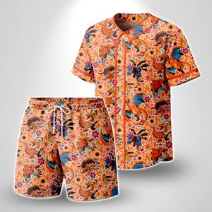 May include: A short-sleeved button-down baseball jersey and matching shorts set featuring an all-over orange print of various dragon-like creatures, flames, and colorful star-shaped flowers. The jersey has orange trim and white buttons.