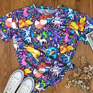 Umbreon Eevee Grafik-T-Shirt Buntes Fantasie-Waldmuster Unisex-T-Stück Niedliche Karikatur-lässige Ausstattung Evoli-Evolutions-Hemd Geschenke