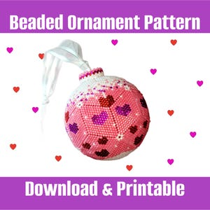 May include: A pink and white beaded ornament shaped like a Christmas tree ball with a white ribbon. The ornament is covered in small pink and white beads and has a pattern of hearts on it. The ornament is on a white background with pink hearts scattered around it. The text "Beaded Ornament Pattern" is at the top of the image and the text "Download & Printable" is at the bottom of the image.