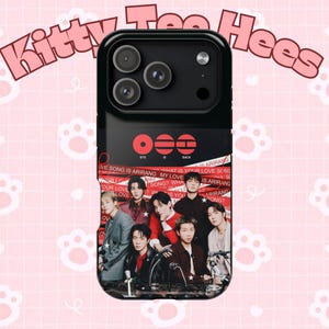 May include: Black phone case with a photograph of a group of people. The top section is black with camera lenses. Red text reads "BTS IS BACK." The bottom section has a red and white design with text and images.