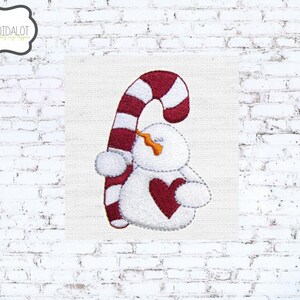 Snowman machine embroidery design. Cute Christmas embroidery snowman with candy cane. Fun winter embroidery with a whimsical touch.