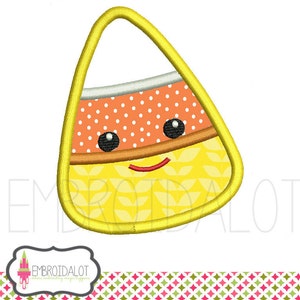 May include: A yellow, orange, and white candy corn with a smiling face. The candy corn has a dotted pattern and a leaf design.