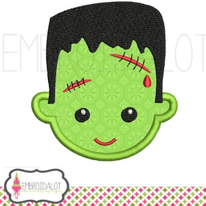 May include: Green monster face with black hair, stitched scars, and a red drop of blood. The face has a green background with a pattern of small white flowers.