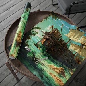 May include: A roll of green and yellow wrapping paper and a wrapped gift with a brown bow sit on a wooden table. The wrapping paper features a pirate ship design. Scissors and tape are also on the table.