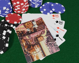 May include: Poker chips in black, red, and blue are stacked on a green felt surface. A hand of playing cards shows a ten of hearts, ten of diamonds, ten of spades, and a jack of spades. One card features a colorful illustration.