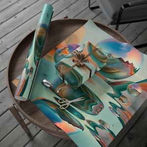 May include: A roll of wrapping paper and a wrapped gift with a brown ribbon sit on a wooden table. The paper and gift have a teal, orange, and brown abstract design. A pair of scissors is on the paper.