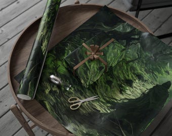 May include: A roll of green and black patterned wrapping paper, a wrapped gift with a brown ribbon, and a sheet of matching paper are arranged on a wooden table. Gold scissors and a silver tape dispenser are also on the table. The gift wrap has a forest-like design.