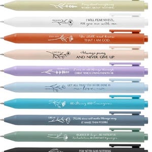 May include: A collection of ten colorful pens with inspirational quotes and floral designs. The pens are in various colors, including green, white, orange, pink, purple, blue, teal, gray, and black. Each pen has a different message.