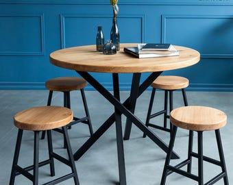 BRAVION Round oak table Omega with bell legs