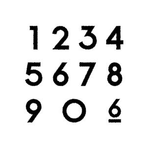 May include: Black numbers 1 through 9 and a zero, plus a 6 with a line underneath, are displayed on a white background. The numbers have a textured, slightly fuzzy appearance.