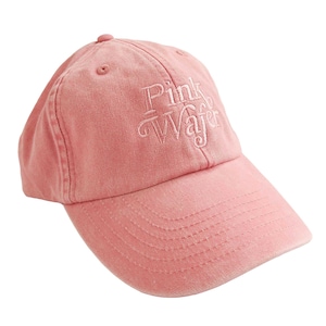 May include: A pink baseball cap with the words "Pink Wafer" embroidered in white on the front.