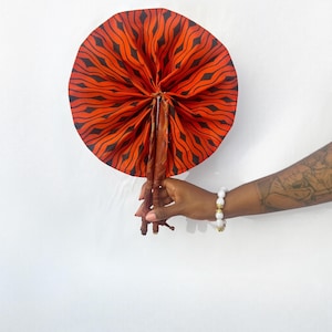 Handmade African wax and leather fan – Traditional folding accessory – Orange ethnic fan – Ivory Coast crafts –