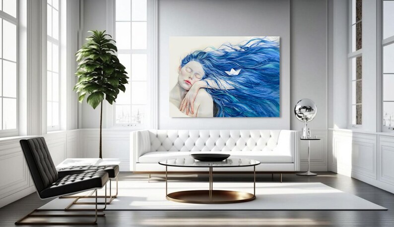 May include: A rectangular wall art print featuring a painting of a figure with pale skin and long, flowing blue hair. A small white paper boat rests within the hair. The figure has closed eyes and rests their head on their arms in a calm pose.