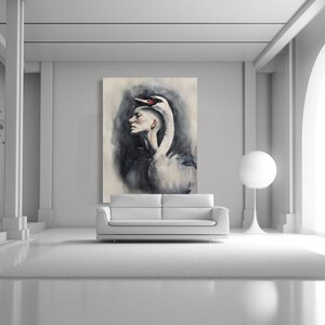 May include: A large rectangular wall art print featuring a surrealist painting of a human profile merging with the neck and head of a white swan. The artwork uses a monochromatic palette of black, white, and gray tones with soft, blended brushstrokes.