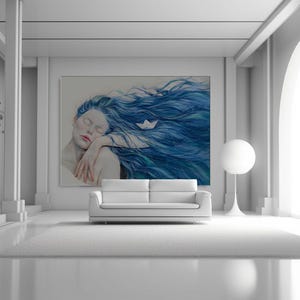 May include: A large rectangular wall art print featuring a painting of a person with long, flowing blue hair and closed eyes, resting their head on their arms. A small white paper boat is nestled within the strands of the vibrant blue hair.
