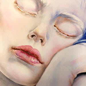 May include: A watercolor painting of a face with closed eyes, pale skin, and pink lips. The figure has vibrant blue hair visible at the top and rests their head on a hand. The artwork features soft shading, delicate brushstrokes, and cool tones.