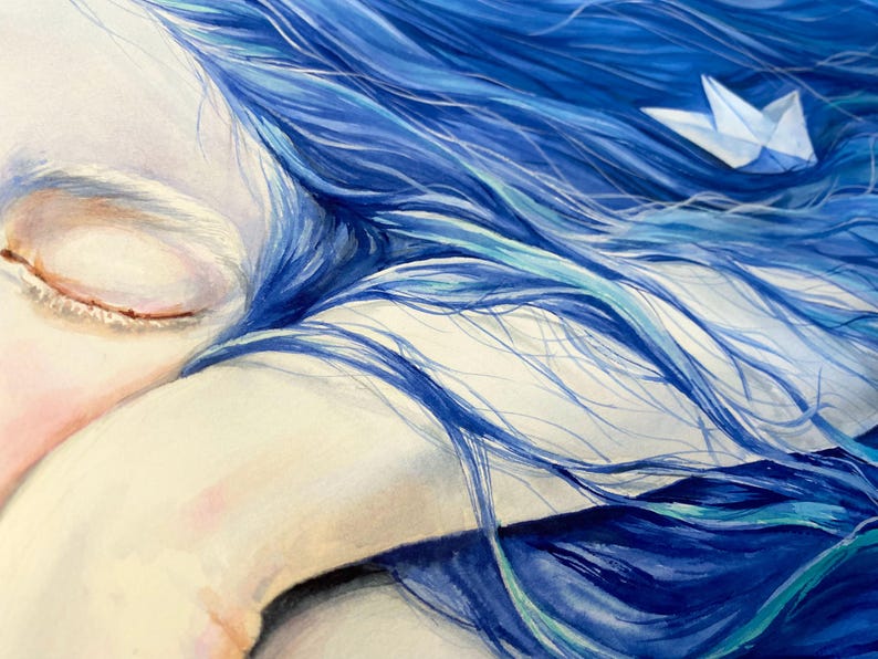 May include: A painting of a face with closed eyes resting on an arm, surrounded by flowing, vibrant blue hair. A small, white paper boat is nestled within the strands of hair, creating a contrast against the deep blue and teal color palette.