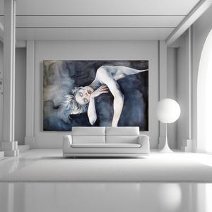May include: A large rectangular wall art piece featuring a dark, moody watercolor painting of a reclining figure with pale skin and messy hair, set against a deep blue and black abstract background, displayed above a white sofa.