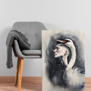 May include: A rectangular canvas print featuring a watercolor painting of a person with a shaved head in profile, with a white swan draped over their head and shoulders. The artwork uses shades of black, gray, and white with a red swan beak.