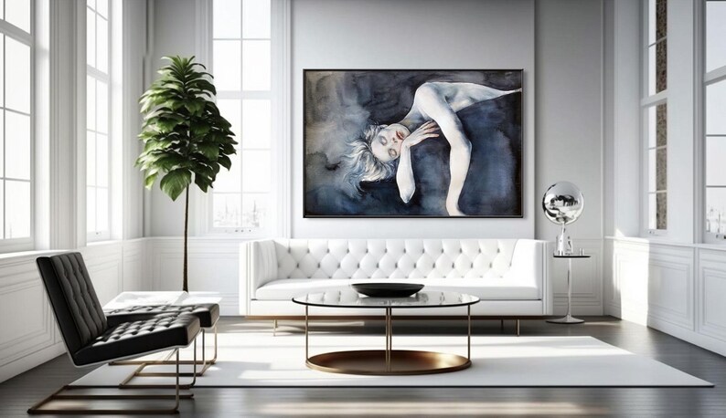 May include: A large rectangular wall art piece featuring a stylized painting of a pale figure with light hair, posed against a dark, moody, swirling blue and black background, framed in a thin black border and displayed in a bright room.