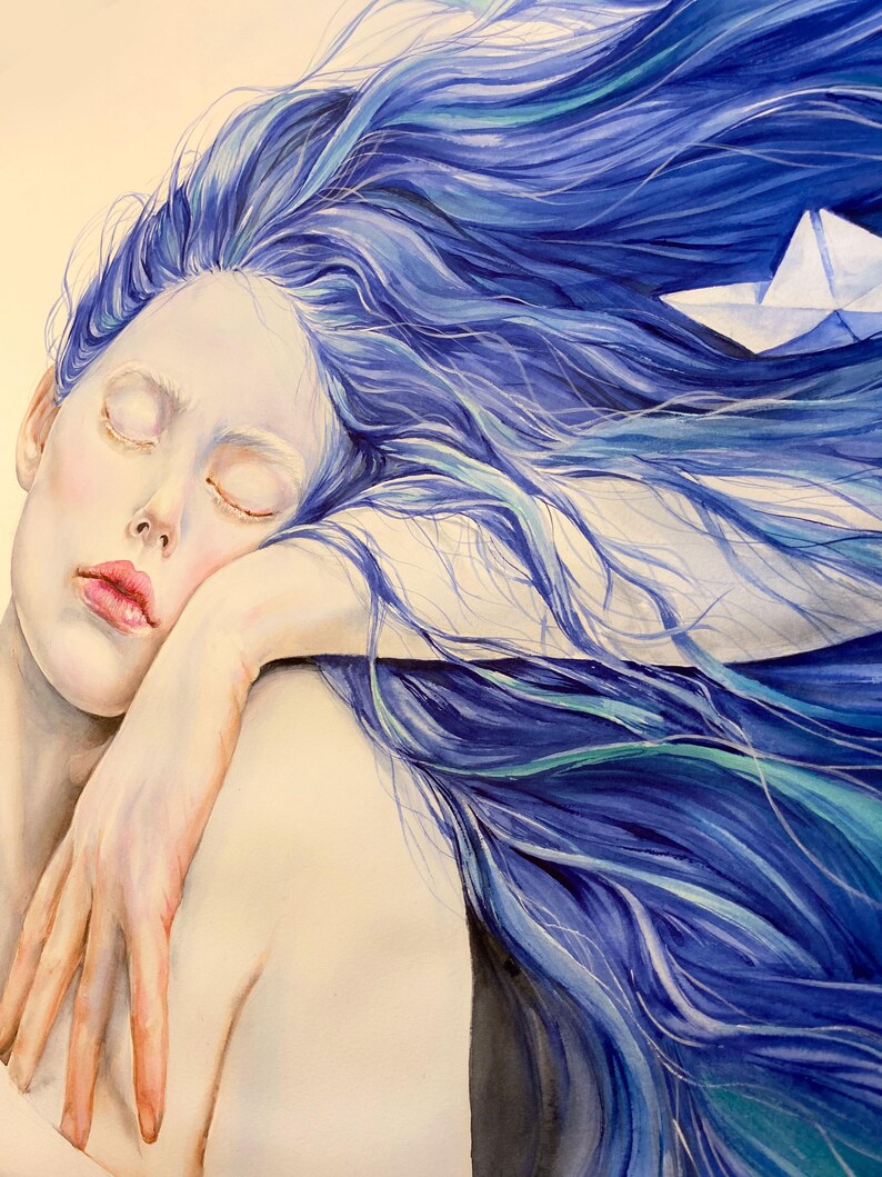 May include: A watercolor painting depicting a person with long, flowing blue hair resting their head on their arm. A small white paper boat is nestled within the strands of hair. The person has closed eyes and pale skin, with soft pink lips.
