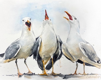 May include: A watercolor painting depicting three seagulls standing side by side. The birds have white heads, grey and black wings, and yellow legs. Each seagull has its beak open, facing upward or forward, against a light blue wash background.
