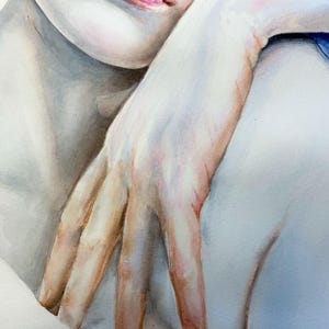 May include: A watercolor painting depicting a close-up of a face and a hand resting near the chin. The artwork features soft skin tones with pinkish highlights on the lips and fingers, contrasted by a vibrant blue element at the top right corner.