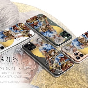 May include: Three phone cases featuring an illustration of a figure with white hair, a blue shirt, and gold accents against a yellow circle. The text on the cases includes names like Diana, Agatha, and Kanya. The background displays the text ARIES ZODIAC COLLECTION PERSONALISED LIMITED EDITION PHONE CASE DESIGNER'S CROP by KARAMFILA SIDEROVA.