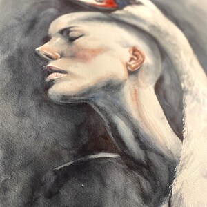 May include: A watercolor painting depicting a profile view of a person with a shaved head, eyes closed, and a white swan resting its neck and head over the top of the person's head. The background is a dark, moody charcoal gray wash.