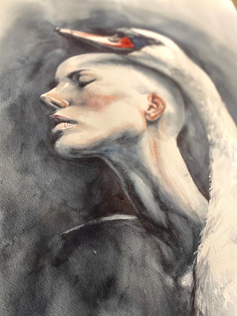 May include: A watercolor painting depicting a profile view of a person with a shaved head, eyes closed, and a white swan resting its neck and head over the top of the person's head. The background is a dark, moody charcoal gray wash.
