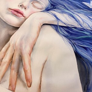 May include: A watercolor painting depicting a person with long, flowing blue hair resting their head on their hand. A small white paper boat is nestled within the vibrant blue hair strands. The figure has pale skin and soft pink lips.