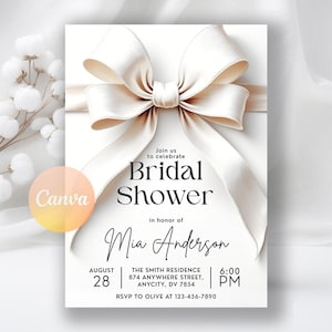 May include: A white bridal shower invitation with a large ivory ribbon. The invitation includes the text "Join us to celebrate Bridal Shower in honor of Mia Anderson." The date, time, and location are also listed.