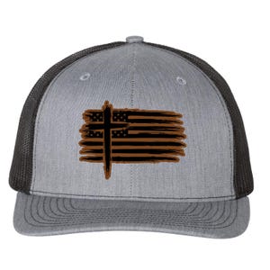 May include: A gray and black trucker hat with a brown and black American flag with a cross design.