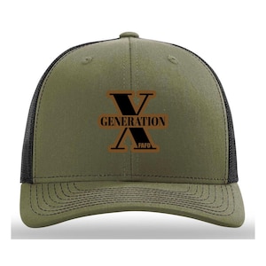 May include: Olive green trucker hat with a black mesh back. The front features a brown graphic with the text "GENERATION" and "FAFO" in a bold, sans-serif font. The hat has a curved brim and a structured crown.