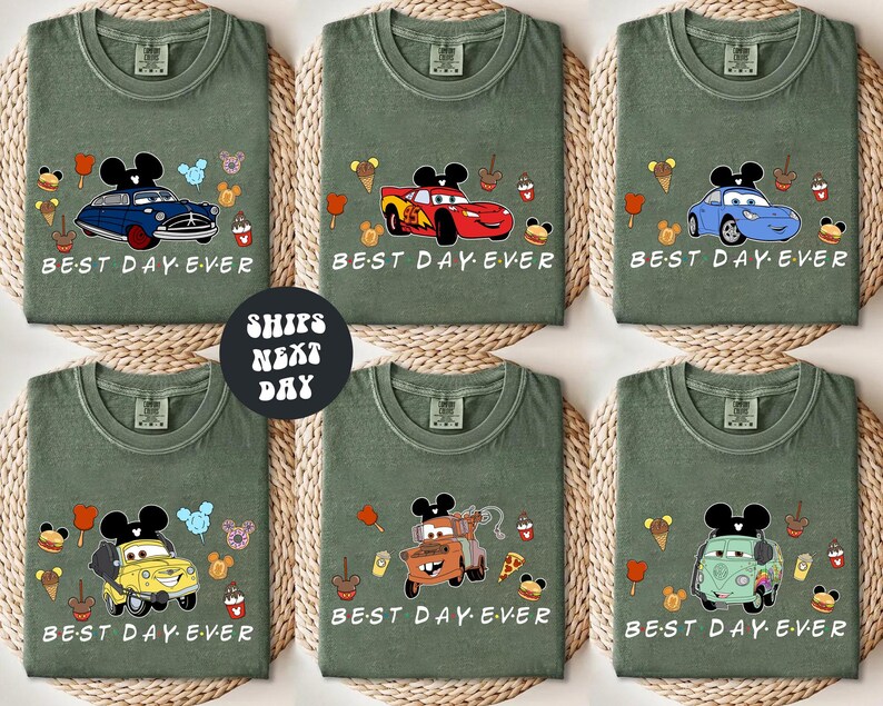 six green t-shirts with various cartoon car designs and the text "BEST DAY EVER" printed on them.