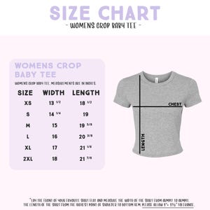The image is a size chart for a women's crop baby tee. It provides measurements for different sizes, including XS, S, M, L, and XL, along with the corresponding chest measurements. The chart also includes a diagram of the shirt, which can be used to visualize the measurements. The text on the chart advises to lay the front of the favorite shirt flat and measure the width of the shirt from the highest point of shoulder to the bottom hem, and to allow for 1 1/2" tolerance.