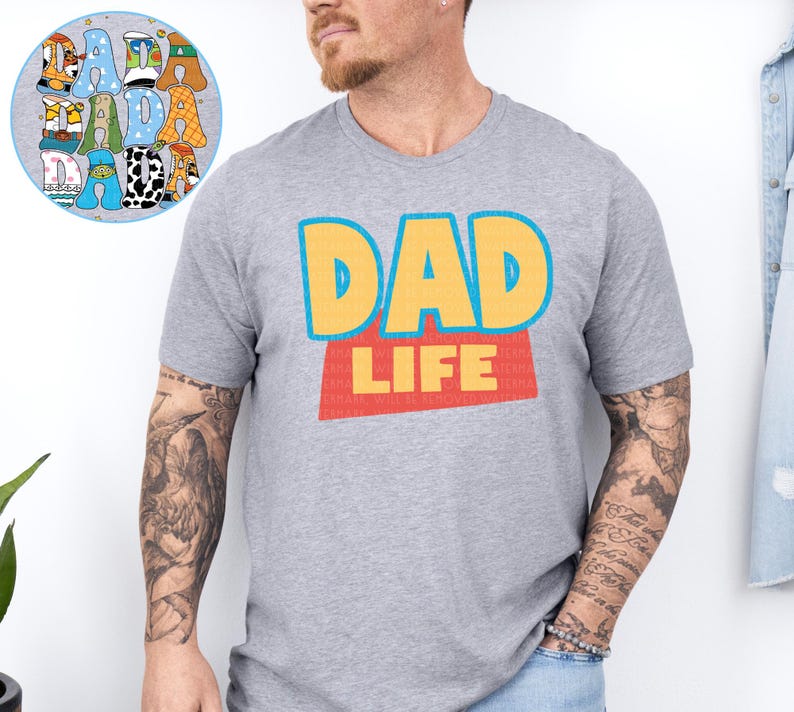 A man wearing a gray t-shirt with the text "DAD LIFE" printed on it.