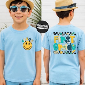 A young boy wearing a blue t-shirt with a smiley face and the name "JASON" printed on it, along with a straw hat and sunglasses.