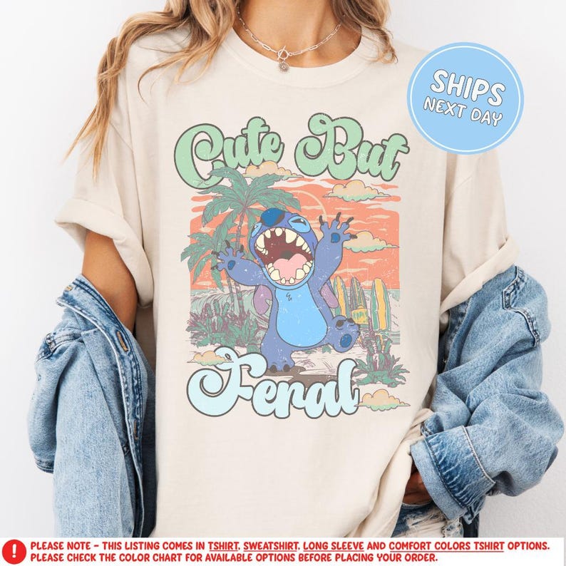 a woman wearing a t - shirt with a cartoon character on it