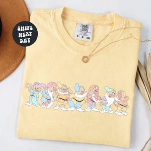 May include: A set of three ceramic mugs with a speckled, matte finish. The mugs are in shades of cream, light gray, and dark gray. Each mug has a simple, minimalist design, perfect for coffee or tea.