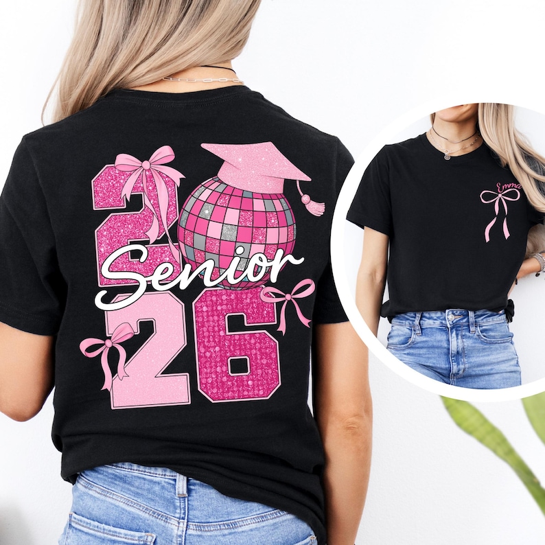A woman wearing a black t-shirt with a pink and black design that says "2016 Senior" and features a graduation cap, a disco ball, and a ribbon.